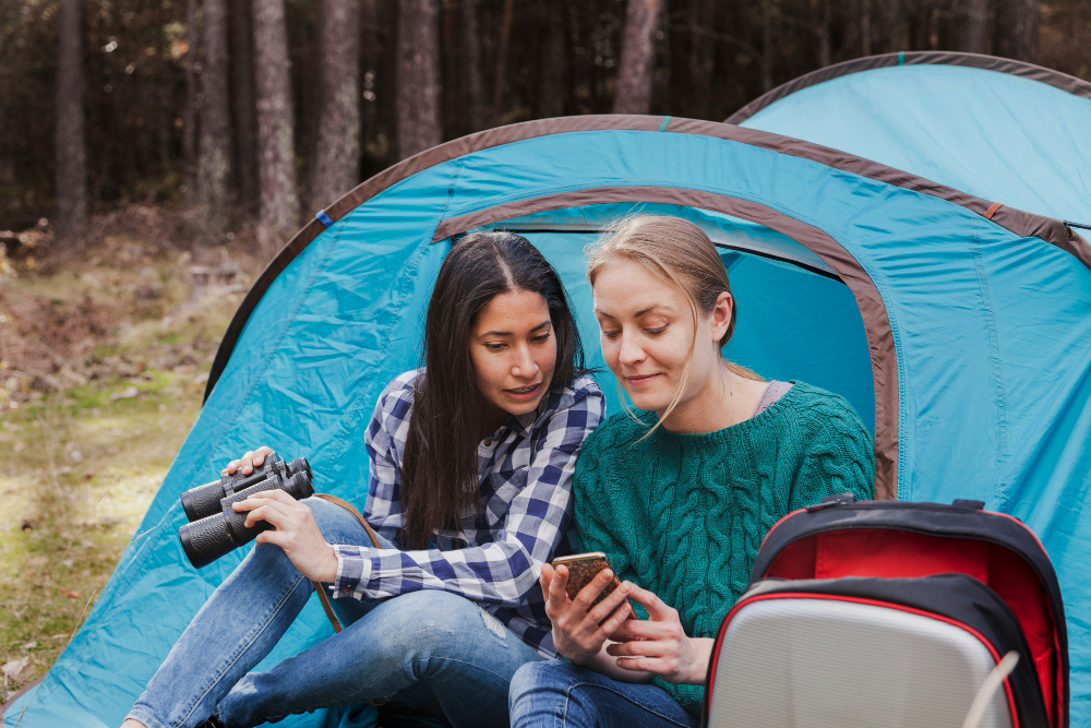 Campers checking weather conditions on a mobile device